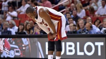 Oct 29, 2014; Miami, FL, USA; Miami Heat guard Dwyane Wade (3) reacts after being injured on a play against the Washington Wizards during the second half at American Airlines Arena. Miami won 107-95. Mandatory Credit: Steve Mitchell-USA TODAY Sports