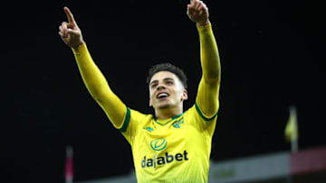 NORWICH, ENGLAND - FEBRUARY 28: Max Aarons of Norwich City celebrates after Jamal Lewis scores his sides first goal during the Premier League match between Norwich City and Leicester City at Carrow Road on February 28, 2020 in Norwich, United Kingdom. (Photo by Julian Finney/Getty Images)