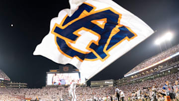 An Auburn Tigers cheerleader waves their flag (Photo by Michael Chang/Getty Images)