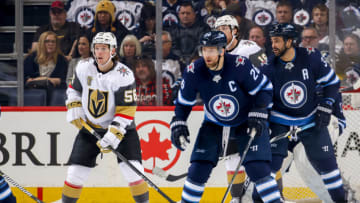 WINNIPEG, MB - FEBRUARY 1: Erik Haula #56 of the Vegas Golden Knights and Blake Wheeler #26 of the Winnipeg Jets keep an eye on the play during second period action at the Bell MTS Place on February 1, 2018 in Winnipeg, Manitoba, Canada. The Knights defeated the Jets 3-2 in overtime. (Photo by Jonathan Kozub/NHLI via Getty Images)