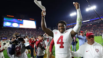 AUBURN, ALABAMA - NOVEMBER 25: Jalen Milroe #4 of the Alabama Crimson Tide celebrates their 27-24 win over the Auburn Tigers at Jordan-Hare Stadium on November 25, 2023 in Auburn, Alabama. (Photo by Kevin C. Cox/Getty Images)
