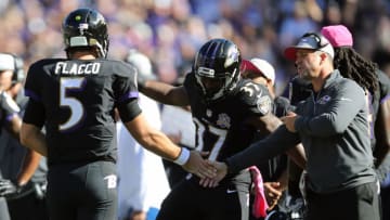 BALTIMORE, MD - OCTOBER 11: Quarterback Joe Flacco #5 of the Baltimore Ravens celebrates with head coach John Harbaugh and running back Javorius Allen #37 of the Baltimore Ravens after scoring a touchdown in the third quarter of a game against the Cleveland Browns at M&T Bank Stadium on October 11, 2015 in Baltimore, Maryland. (Photo by Patrick Smith/Getty Images)