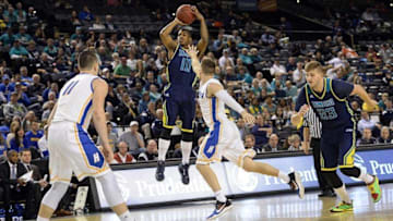 Mar 7, 2016; Baltimore, MD, USA; North Carolina-Wilmington Seahawks guard Denzel Ingram (10) shoots over Hofstra Pride guard Brian Bernardi (14) during the first half of the CAA conference tournament finals at Royal Farms Arena. Mandatory Credit: Tommy Gilligan-USA TODAY Sports