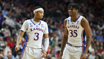 Mar 18, 2023; Des Moines, IA, USA; Kansas Jayhawks guard Dajuan Harris Jr. (3) an dforward Zuby Ejiofor (35) react during the second half against the Arkansas Razorbacks at Wells Fargo Arena. Mandatory Credit: Jeffrey Becker-USA TODAY Sports