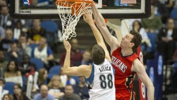 Apr 13, 2016; Minneapolis, MN, USA; New Orleans Pelicans center Omer Asik (3) dunks the ball past Minnesota Timberwolves forward Nemanja Bjelica (88) in the second half at Target Center. The Timberwolves won 144-109. Mandatory Credit: Jesse Johnson-USA TODAY Sports
