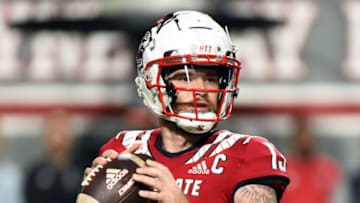 Oct 8, 2022; Raleigh, North Carolina, USA; North Carolina State Wolfpack quarterback Devin Leary (13) looks to throw during the first half against the Florida State Seminoles at Carter-Finley Stadium. Mandatory Credit: Rob Kinnan-USA TODAY Sports