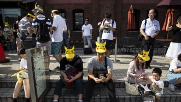 YOKOHAMA, JAPAN - AUGUST 09: People play Nintendo Co.'s Pokemon Go augmented reality game on their smartphones during the Pikachu Outbreak event hosted by The Pokemon Co. on August 9, 2017 in Yokohama, Kanagawa, Japan. A total of 1, 500 Pikachus appear at the city's landmarks in the Minato Mirai area aiming to attract visitors and tourists to the city. The event will be held through until August 15. (Photo by Tomohiro Ohsumi/Getty Images)