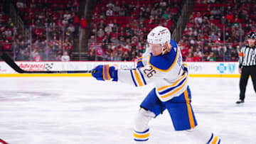 Dec 4, 2021; Raleigh, North Carolina, USA; Buffalo Sabres defenseman Rasmus Dahlin (26) takes a first period shot against the Carolina Hurricanes at PNC Arena. Mandatory Credit: James Guillory-USA TODAY Sports