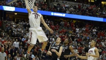 Mar 27, 2014; Anaheim, CA, USA; Arizona Wildcats forward Aaron Gordon (11) dunks the ball past San Diego State Aztecs forward Matt Shrigley (40) during the second half in the semifinals of the west regional of the 2014 NCAA Mens Basketball Championship tournament at Honda Center. Mandatory Credit: Richard Mackson-USA TODAY Sports