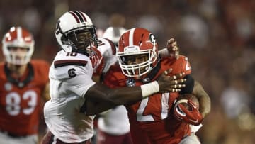 Sep 19, 2015; Athens, GA, USA; Georgia Bulldogs running back Nick Chubb (27) runs against South Carolina Gamecocks linebacker Skai Moore (10) during the second half at Sanford Stadium. Georgia defeated South Carolina 52-20. Mandatory Credit: Dale Zanine-USA TODAY Sports