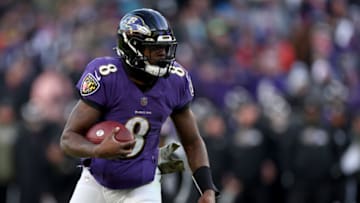 Lamar Jackson #8 of the Baltimore Ravens rushes for a fourth quarter touchdown against the Carolina Panthers at M&T Bank Stadium on November 20, 2022 in Baltimore, Maryland. (Photo by Rob Carr/Getty Images)
