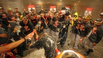 Oct 2, 2016; Bronx, NY, USA; The Baltimore Orioles spray manager Buck Showalter with champagne after beating the New York Yankees 5-2 to clinch an American League Wild Card playoff spot at Yankee Stadium. Mandatory Credit: Danny Wild-USA TODAY Sports