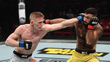 STOCKHOLM, SWEDEN - JUNE 01: (L-R) Sergey Khandozhko of Russia punches Rostam Akman of Sweden in their welterweight bout during the UFC Fight Night event at Ericsson Globe on June 1, 2019 in Stockholm, Sweden. (Photo by Jeff Bottari/Zuffa LLC/Zuffa LLC via Getty Images)