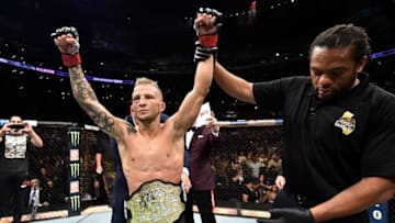 LOS ANGELES, CA - AUGUST 04: TJ Dillashaw celebrates after his knockout victory over Cody Garbrandt in their UFC bantamweight championship fight during the UFC 227 event inside Staples Center on August 4, 2018 in Los Angeles, California. (Photo by Jeff Bottari/Zuffa LLC/Zuffa LLC via Getty Images)