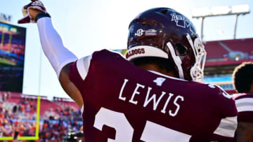 TAMPA, FLORIDA - JANUARY 02: John Lewis #37 of the Mississippi State Bulldogs points to the scoreboard after defeating the Illinois Fighting Illini 19-10 in the ReliaQuest Bowl at Raymond James Stadium on January 02, 2023 in Tampa, Florida. (Photo by Julio Aguilar/Getty Images)