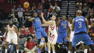 Oct 7, 2015; Houston, TX, USA; Dallas Mavericks guard Raymond Felton (2) passes the ball against Houston Rockets forward Sam Dekker (7) in the first quarter at Toyota Center. Mandatory Credit: Thomas B. Shea-USA TODAY Sports