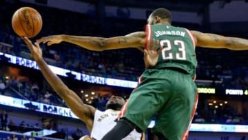 Mar 17, 2015; New Orleans, LA, USA; New Orleans Pelicans guard Tyreke Evans (1) shoots as Milwaukee Bucks forward Chris Johnson (23) defends during the first half of game at the Smoothie King Center. Mandatory Credit: Derick E. Hingle-USA TODAY Sports