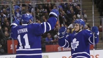 Mar 21, 2016; Toronto, Ontario, CAN; Toronto Maple Leafs forward Zach Hyman (11) celebrates his goal with forward William Nylander (39) during the second period against the Calgary Flames at the Air Canada Centre. Mandatory Credit: John E. Sokolowski-USA TODAY Sports