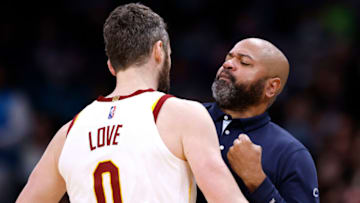 CHARLOTTE, NORTH CAROLINA - FEBRUARY 04: Kevin Love #0 chest-bumps head coach J.B. Bickerstaff of the Cleveland Cavaliers after a three-point basket against the Charlotte Hornets during the second half of their game at Spectrum Center on February 04, 2022 in Charlotte, North Carolina. The Cavaliers won 102-101. NOTE TO USER: User expressly acknowledges and agrees that, by downloading and or using this photograph, User is consenting to the terms and conditions of the Getty Images License Agreement. (Photo by Grant Halverson/Getty Images)