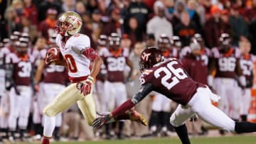 BLACKSBURG, VA - NOVEMBER 08: Wide receiver Rashad Greene #80 of the Florida State Seminoles runs with the ball past safety Desmond Frye #26 of the Virginia Tech Hokies to score the game-winning touchdown in the final minute at Lane Stadium on November 8, 2012 in Blacksburg, Virginia. The Seminoles won 28-22. (Photo by Geoff Burke/Getty Images)