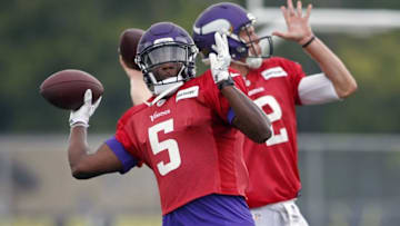 Aug 1, 2016; Mankato, MN, USA; Minnesota Vikings quarterback Teddy Bridgewater (5) and quarterback Joel Stave (2) throw passes in drills during training camp at Minnesota State University. Mandatory Credit: Bruce Kluckhohn-USA TODAY Sports