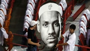 May 30, 2014; Miami, FL, USA; Fans of the Miami Heat carry in a cutout head of forward LeBron James (not pictured) before game six of the Eastern Conference Finals of the 2014 NBA Playoffs against the Indiana Pacers at American Airlines Arena. Mandatory Credit: Robert Mayer-USA TODAY Sports