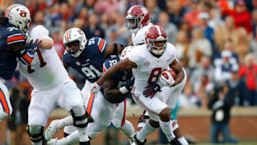 Auburn footballAUBURN, AL - NOVEMBER 25: Josh Jacobs #8 of the Alabama Crimson Tide is tackled by Nick Brahms #52 of the Auburn Tigers during the second quarter of the game at Jordan Hare Stadium on November 25, 2017 in Auburn, Alabama. (Photo by Kevin C. Cox/Getty Images)
