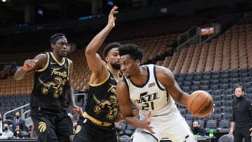 TORONTO, ON - JANUARY 7: Hassan Whiteside #21 of the Utah Jazz drives against Khem Birch #24 and Pascal Siakam #43 of the Toronto Raptors (Photo by Mark Blinch/Getty Images)
