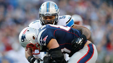 Nov 23, 2014; Foxborough, MA, USA; New England Patriots tight end Rob Gronkowski (87) is tackled by Detroit Lions linebacker DeAndre Levy (54) during the second quarter at Gillette Stadium. Mandatory Credit: Greg M. Cooper-USA TODAY Sports