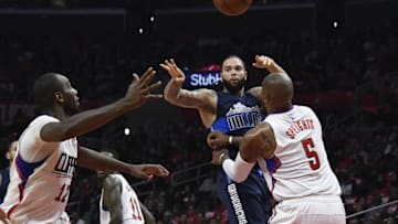 Dec 23, 2016; Los Angeles, CA, USA; Dallas Mavericks guard Deron Williams (8) passes the ball away from LA Clippers center Marreese Speights (5) in the first half of the NBA basketball game at Staples Center. Mandatory Credit: Richard Mackson-USA TODAY Sports