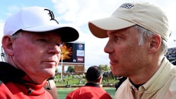 WINSTON SALEM, NC - OCTOBER 28: Head coach Dave Clawson of the Wake Forest Demon Deacons shakes hands with head coach Bobby Petrino of the Louisville Cardinals following the Deacons' victory in the football game at BB&T Field on October 28, 2017 in Winston Salem, North Carolina. (Photo by Mike Comer/Getty Images)