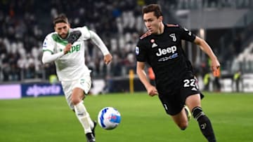 Juventus' Italian forward Federico Chiesa (R) outflanks Sassuolo's Italian forward Domenico Berardi during the Italian Serie A football match between Juventus and Sassuolo on October 27, 2021 at the Juventus stadium in Turin. (Photo by Marco BERTORELLO / AFP) (Photo by MARCO BERTORELLO/AFP via Getty Images)