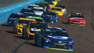 PHOENIX, AZ - NOVEMBER 11: Martin Truex Jr., driver of the #78 Auto-Owners Insurance Toyota, leads a pack of cars during the Monster Energy NASCAR Cup Series Can-Am 500 at ISM Raceway on November 11, 2018 in Phoenix, Arizona. (Photo by Sarah Crabill/Getty Images)