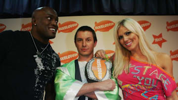 SYDNEY, AUSTRALIA - OCTOBER 10: WWE Wrestlers Bobby Lashley and Torrie Wilson pose with TV Host Rove McManus at the Nickelodeon Australian Kids' Choice Awards 2007 at the Sydney Entertainment Centre on October 10, 2007 in Sydney, Australia. (Photo by Gaye Gerard/Getty Images)