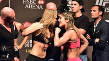Jul 31, 2015; Rio de Janeiro, RJ, Brazil; Ronda Rousey (left) and Bethe Correia (right) face off during weigh-ins for UFC 190 at HSBC Arena. Mandatory Credit: Jason Silva-USA TODAY Sports