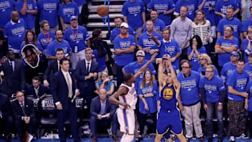 May 28, 2016; Oklahoma City, OK, USA; Golden State Warriors guard Klay Thompson (11) scores over Oklahoma City Thunder forward Kevin Durant (35) during the fourth quarter in game six of the Western conference finals of the NBA Playoffs at Chesapeake Energy Arena. Mandatory Credit: Kevin Jairaj-USA TODAY Sports