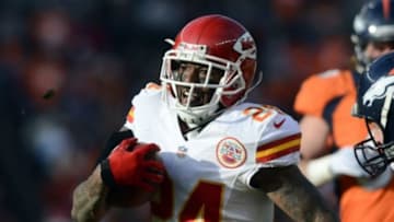 Dec 30 2012; Denver, CO, USA; Kansas City Chiefs cornerback Brandon Flowers (24) returns a fumble for sixty four yards in the first quarter against the Denver Broncos at Sports Authority Field. Mandatory Credit: Ron Chenoy-USA TODAY Sports