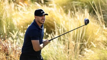 LA QUINTA, CALIFORNIA - JANUARY 21: Brooks Koepka reacts to his shot from the 18th tee during the first round of The American Express tournament on the Jack Nicklaus Tournament Course at PGA West on January 21, 2021 in La Quinta, California. (Photo by Harry How/Getty Images)