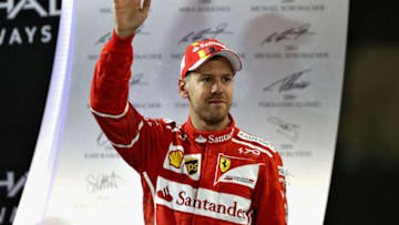 ABU DHABI, UNITED ARAB EMIRATES - NOVEMBER 26: Third place finisher Sebastian Vettel of Germany and Ferrari celebrates on the podium during the Abu Dhabi Formula One Grand Prix at Yas Marina Circuit on November 26, 2017 in Abu Dhabi, United Arab Emirates. (Photo by Mark Thompson/Getty Images)