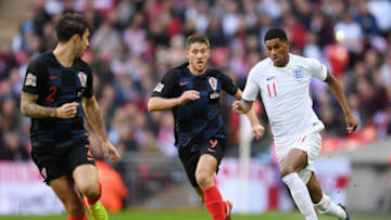 LONDON, ENGLAND - NOVEMBER 18: Marcus Rashford of England runs with the ball under pressure from Andrej Kramaric of Croatia during the UEFA Nations League A group four match between England and Croatia at Wembley Stadium on November 18, 2018 in London, United Kingdom. (Photo by Laurence Griffiths/Getty Images)