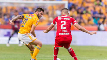 MONTERREY, MEXICO - AUGUST 11: Andre-Pierre Gignac of Tigres fights for the ball with Omar Tobio of Toluca during the fourth round match between Tigres UANL and Toluca as part of the Torneo Apertura 2018 Liga MX at Universitario Stadium on July 14, 2018 in Monterrey, Mexico. (Photo by Azael Rodriguez/Getty Images)