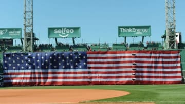 Jun 18, 2016; Boston, MA, USA; The American flag is hung over the center field wall prior to a game between the Boston Red Sox and the Seattle Mariners inning at Fenway Park. Mandatory Credit: Bob DeChiara-USA TODAY Sports