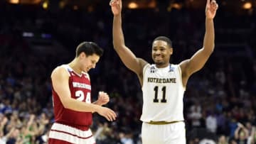 Mar 25, 2016; Philadelphia, PA, USA; Notre Dame Fighting Irish guard Demetrius Jackson (11) and Wisconsin Badgers guard Bronson Koenig (24) react after a semifinal game in the East regional of the NCAA Tournament at Wells Fargo Center. Notre Dame won 61-56. Mandatory Credit: Bob Donnan-USA TODAY Sports