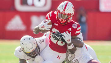 LINCOLN, NE - OCTOBER 27: Nebraska Cornhuskers running back Miles Jones (26) is brought down by Bethune Cookman Wildcats cornerback DeRon Maxwell (4) and Bethune Cookman Wildcats linebacker Trenton Bridges (42) during the game between the Bethune-Cookman Wildcats and the Nebraska Cornhuskers on Saturday October 27, 2018 at Memorial Stadium in Lincoln, Nebraska. (Photo by Nick Tre. Smith/Icon Sportswire via Getty Images)