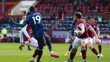BURNLEY, ENGLAND - MARCH 06: Nicolas Pepe of Arsenal takes a shot at the goal which is blocked by Erik Pieters of Burnley FC during the Premier League match between Burnley and Arsenal at Turf Moor on March 06, 2021 in Burnley, England. Sporting stadiums around the UK remain under strict restrictions due to the Coronavirus Pandemic as Government social distancing laws prohibit fans inside venues resulting in games being played behind closed doors. (Photo by Chloe Knott - Danehouse/Getty Images)