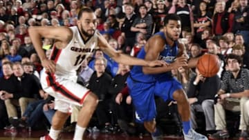 Mar 3, 2015; Athens, GA, USA; Kentucky Wildcats guard Andrew Harrison (5) dribbles past Georgia Bulldogs forward Cameron Forte (11) at Stegeman Coliseum. Kentucky defeated Georgia 72-64. Mandatory Credit: Dale Zanine-USA TODAY Sports