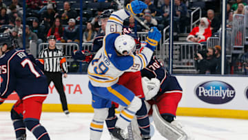 Dec 7, 2022; Columbus, Ohio, USA; Buffalo Sabres center Peyton Krebs (19) collides with Columbus Blue Jackets defenseman Erik Gudbranson (44) during the third period at Nationwide Arena. Mandatory Credit: Russell LaBounty-USA TODAY Sports