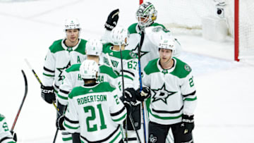 ST PAUL, MN - APRIL 23: Members of the Dallas Stars celebrate their victory against the Minnesota Wild after Game Four of the First Round of the 2023 Stanley Cup Playoffs at Xcel Energy Center on April 23, 2023 in St Paul, Minnesota. The Stars defeated the Wild 3-2 to tie the series 2-2. (Photo by David Berding/Getty Images)