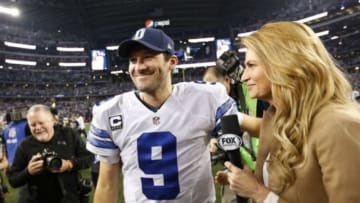 Jan 4, 2015; Arlington, TX, USA; Dallas Cowboys quarterback Tony Romo (9) smiles as he is interviewed by Fox reporter Erin Andrews after a victory against the Detroit Lions in the NFC Wild Card Playoff Game at AT&T Stadium. The Cowboys beat the Lions 24-20. Mandatory Credit: Tim Heitman-USA TODAY Sports