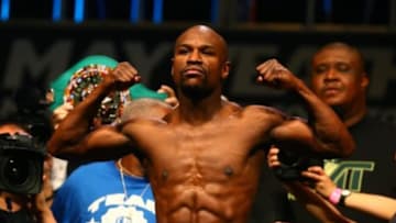 May 2, 2014; Las Vegas, NV, USA; Floyd Mayweather flexes during weigh ins prior to his fight against Marcos Maidana at MGM Grand Garden Arena. Mandatory Credit: Mark J. Rebilas-USA TODAY Sports